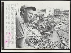 Looking Back on Camille--Parnell McKay, civil defense director of Pass Christian, views the main business district of the demolished town Saturday morning. McKay said he couldn't believe that 190 mile per hour winds of Hurricane Camille did such damage.