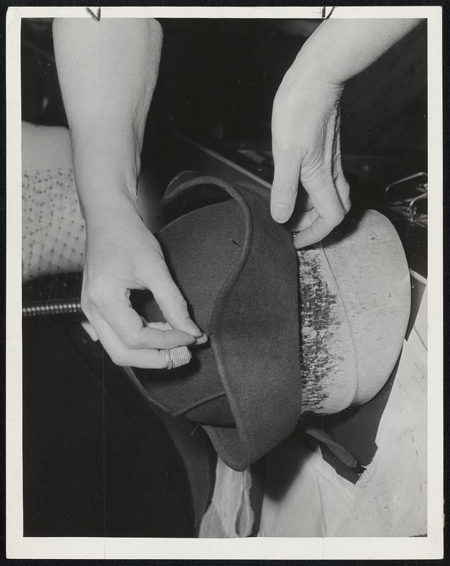 Once Crown Seam is Sewed, "You just pin like this," Milliner explains.