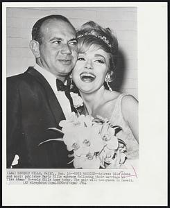 Edie Married -- Actress Edie Adams and music publisher Marty Mills embrace following their marriage at Miss Adams' Beverly Hills home today. The pair will honeymoon in Hawaii.