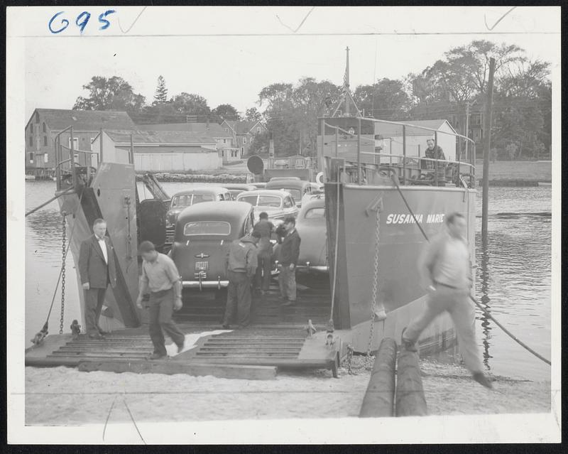 Vacationists' Automobiles Back on Mainland--The Susanna Marie, a former Navy LCT, operated by two war veterans, docks in the Wareham river at Wareham with a cargo of 30 automobiles and a truck load of cranberries from Nantucket. Cars had been held up on the is'and by strike of crews of Massachusetts Steamship Lines.