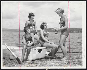 They're Lifeguards-Girl lifeguards get their instructions before going on duty at the Croton Point Park Beach, Harmon, N. Y. Guards Jeanne Hayes, Peekskill, N. Y.; Trudy Graeflin, Tarrytown, N. Y.; Joyce Hartline, Eastview, N. Y., left to right, listen to Chief Life Guard Irene Hallstein of Tarrytown.
