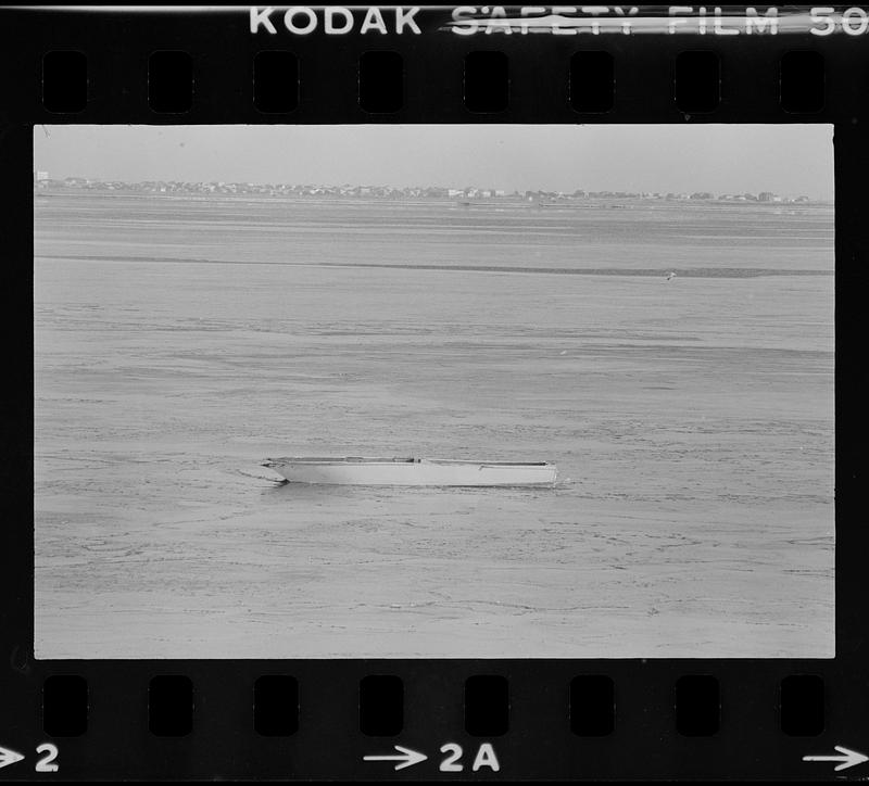 Small boat on shore