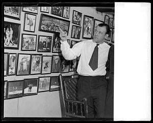 Jack Sharkey points out boxing photos at his Chestnut Hill home