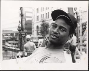 Young man in hat smiling