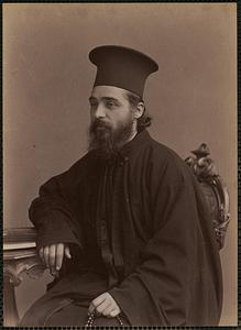 Studio portrait of priest