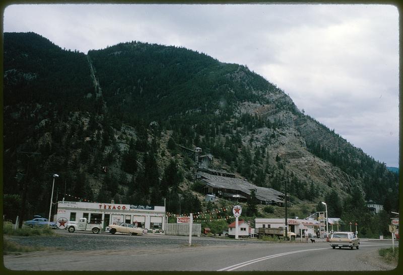 Gas stations at base of a large hill, British Columbia Digital