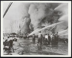 Fire and Flood. Denver (Colo.) Post photographers, Albert Moldvay, won first prize of $250 in the second Fire Foto of the Year Contest sponsored jointly by the National Press Photographers Association and the National Fire Protection Association it was announced today by Percy Bugbee, General Manager of the NFPA. This picture was taken while Moldvay was on an air-borne mission from Denver to cover the 1951 devastating Kansas-Missouri floods. Working ceaselessly day and night Moldvay caught his prize-winning photo at the disastrous million-dollar Kansas City lumber yard fire on July 14.