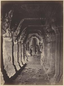 View looking towards sculpture (Vishnu seated on coiled serpent) at east end of verandah of Cave III, Badami
