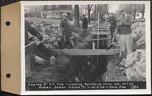 Contract No. 71, WPA Sewer Construction, Holden, laying 8 in. vitrified clay pipe, looking northerly from Sta. 30+35, Holden Sewer, Holden, Mass., Dec. 5, 1939