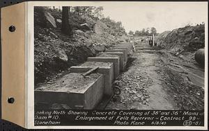 Contract No. 99, Enlargement of Fells High Level Distribution Reservoir, Stoneham, Malden, Melrose, looking north showing concrete covering of 38 inch and 36 inch mains of dam 10, enlargement of Fells Reservoir, Stoneham, Mass., Jun. 8, 1940