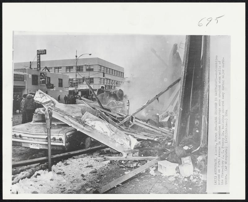 Cars Crushed in Earthquake--Automobiles parked on Fifth Avenue in downtown Anchorage were crushed when walls of the five-story J.C. Penney Co. building sheared away during major earthquake.