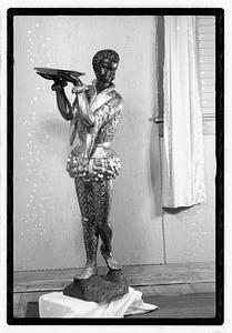 Statue holding a tray