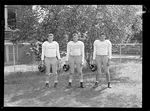 Three players of the Springfield College Football Team pose for a picture