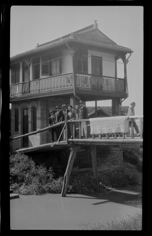 Men in western suits on bridge