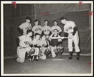 M.I.T. Baseball squad is first college squad to have formal practice. Coach Roy Merrit is demonstrating technique to front row, left to right, Ted Slosek of Ludlow, Pete Peterson of Cleveland, Dick Morganstern of Queens, N.Y.; Paul Valerio of Brooklyn; Back row-Gifford Weber of Linden, N.J.; Capt. Bob Lait of Lynn, Al Hauser of Milton and Bob White of Pelham, N.Y.