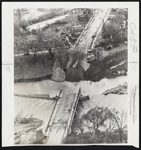 Bridge Out-The Lawrence Avenue Bridge, connecting two west Toronto suburbs, caught the full brunt of the hurricane Hazel. Several suburban communities were isolated by similar washouts.