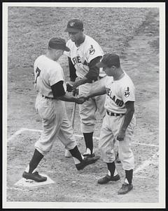Early Crusher for Red Sox comes in third inning as Al Rosen (7) arrives at home plate after his two-run homer and is greeted by base runner Bobby Avila (right) and next batter Larry Doby.