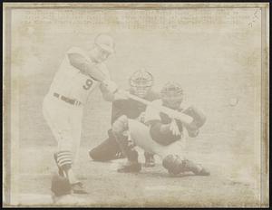 Busch Stadium: Card’s Roger Maris takes vicious swing to drive ball into left field for a 2-run double in 1st inning here 10/8. Catcher is Elston Howard, Umpire, Augie Donatelli. Pitching at time was Jose Santiago.