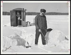 Fishing through ice on lake Winnipesaukee N.H. is Bob Grace - Laconia.