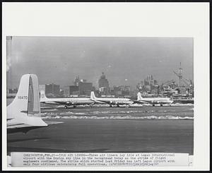 Idle Air Liners--Three air liners lay idle at Logan International Airport with the Boston sky line in the background today as the strike of flight engineers continued. The strike which started last Friday has left Logan Airport with only four airliners maintaining full operations.