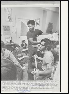 Preparing for Mobilization March--A room full of workers prepare signs today to be worn during the “March Against Death” starting tomorrow as a part of Vietnam Moratorium activities in Washington. The marchers in the single file procession from Arlington Cemetery past the White House and to the Capitol will each wear a name of an American killed in Vietnam.