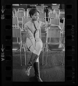 Sad Nigerian woman at press conference, Boston