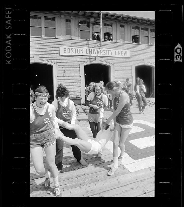 BU women's crew prepares to ritually dunk a team mate, Boston