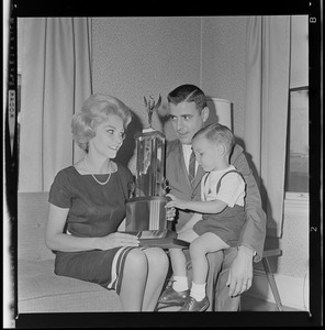 Miss Massachusetts a Mrs.--lovely Elaine Nash, 22, selected Miss Massachusetts last night, holds trophy as she relaxes with her family, husband, Robert 26, and her son, Robert, Jr., in their Freeport St., Dorchester, home