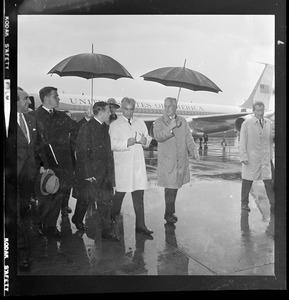 Mohammed Reza Pahlavi, Shah of Iran, is met at Logan Airport by Gov. John A. Volpe and Harvard President Nathan Pusey