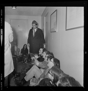 President Morris Abram steps over and around sit-ins outside his Brandeis University office