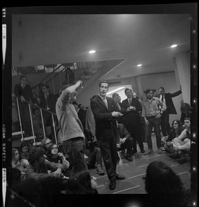 Brandeis University Dean of Students Philip Driscoll and Marty Janowitz, a leader of the sit-in, with demonstrators in the school's administration building