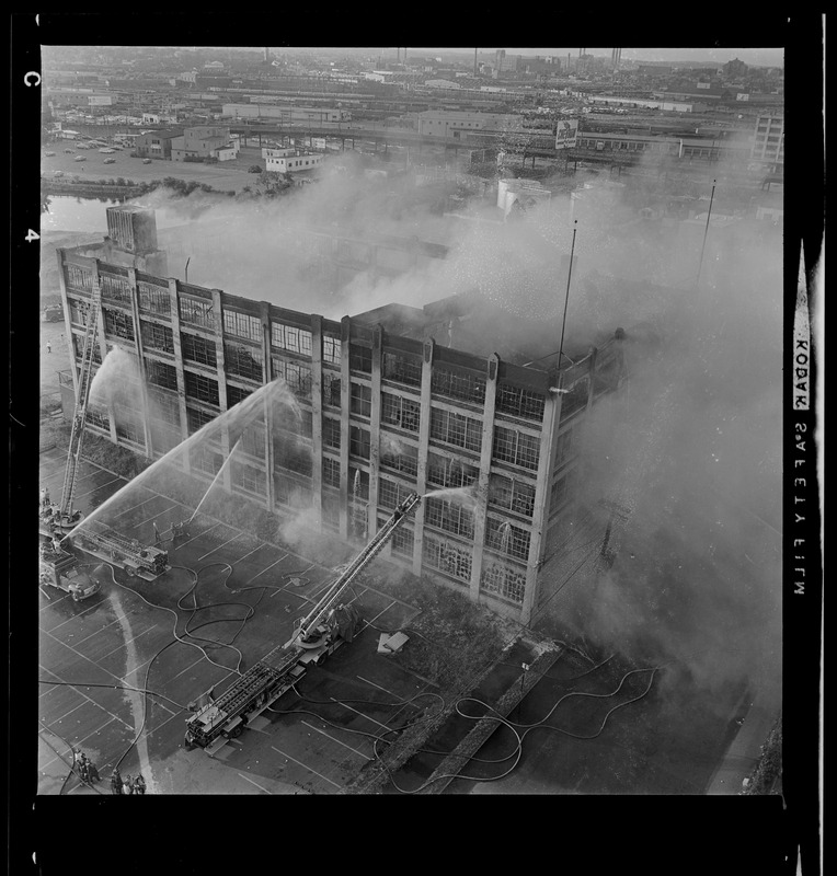 Firefighters hose down gutted ruins of Cambridge warehouse