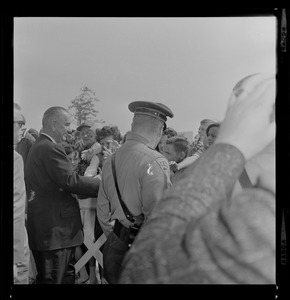 Lyndon B. Johnson greeted by crowds between Worcester Airport and Holy Cross Stadium