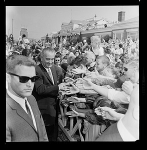 Lyndon B. Johnson greeted by crowds between Worcester Airport and Holy Cross Stadium