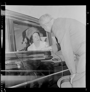 Lady Bird Johnson in car after arriving at Logan Airport