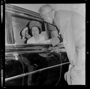 Lady Bird Johnson in car after arriving at Logan Airport