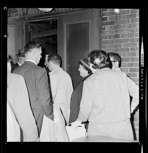 Louise Day Hicks, right, and crowd of people entering back door of Boston School Committee headquarters