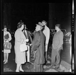 Boston School Chairperson Louise Day Hicks talking with another man outside Boston School Committee headquarters