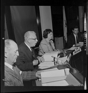 Boston School Superintendent William H. Ohrenberger reading his report as Chairperson Louise Day Hicks looks on
