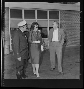 School Committee Chairman Louise Day Hicks guarded by Boston Police as she left City Hospital