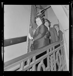 Louise Day Hicks leaving Boston School Committee meeting escorted by Sgt. John Hames