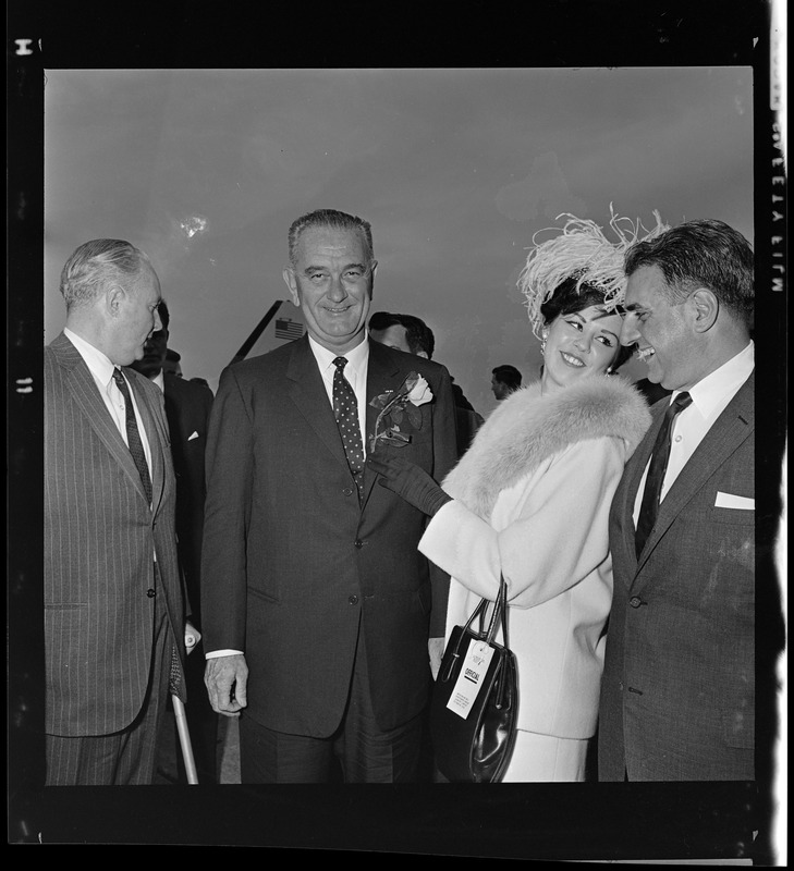Mayor John F. Collins, Vice President Lyndon B. Johnson, Miss Massachusetts Marion Sarristo, and Mayor Kuson J. Haddad at Logan Airport