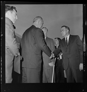 Vice President Lyndon Johnson greeted at Logan Airport by Mayor John F. Collins and unidentified man