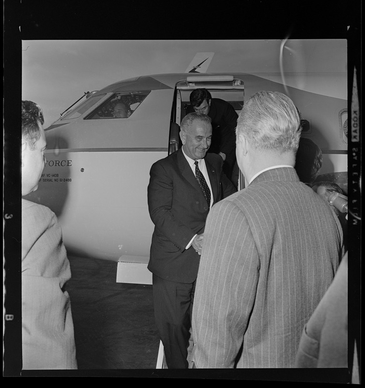 Vice President Lyndon Johnson and Senator Ted Kennedy disembark from Air Force One at Logan Airport