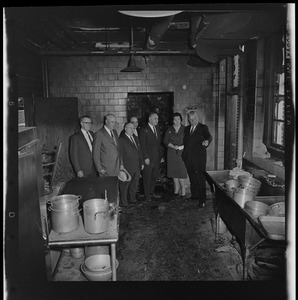 Group touring kitchen damaged by fire at Timilty Junior High School, including principal John Dacey at far left and Louise Day Hicks and William Ohrenberger at right