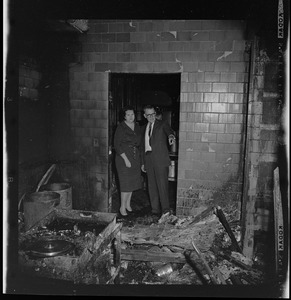 Mrs. Louise Day Hicks and Timilty School Principal view charred debris after arsonists struck in the night