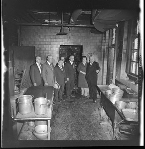 Group touring kitchen damaged by fire at Timilty Junior High School, including principal John Dacey at far left and Louise Day Hicks and William Ohrenberger at right