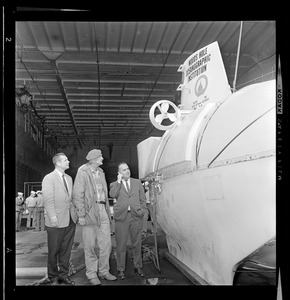 Marvin McCamis, George Roderson, and Valentine Wilson next to the Alvin miniature submarine