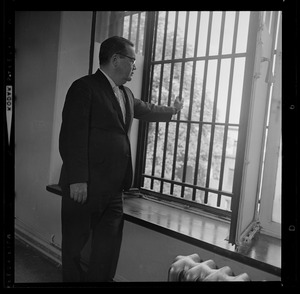 From his Charles St. Jail office, Sheriff Frederick Sullivan views world outside in the wake of a Fin Com order that open hearings on jail break at Charles St. Friday are to be held Monday
