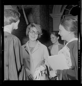 Princess Christina Bernadotte of Sweden with two women in academic dress and Mary Jan Ryder behind them